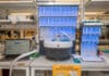 A laptop running PeptiVerse, at left, next to machines used to synthesize peptides, center and at right. Researchers can use PeptiVerse to predict the properties of peptides before incurring the time and expense required to synthesize them. Credit: Sylvia Zhang, Penn Engineering