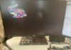 Basys3 FPGA board rendering a colorful low-poly 3D rabbit model on a Dell monitor, running the TinyGPU graphics pipeline