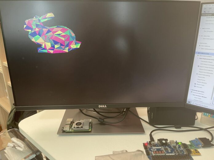 Basys3 FPGA board rendering a colorful low-poly 3D rabbit model on a Dell monitor, running the TinyGPU graphics pipeline