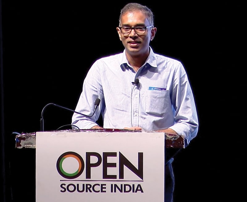 Dr Deepu Benson speaking at Open Source India