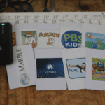 ChipBit Opens RFID-Based Raspberry Pi Computing The reader and a set of printed cards, each linked to one title.
