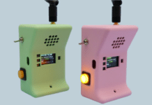 The finished handsets, showing signal strength and “Hold button to talk” on their displays. (Image: Liz Clark / Adafruit)
