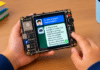 The board displays each question and answer on its touchscreen while speaking the response aloud. (AI illustration)