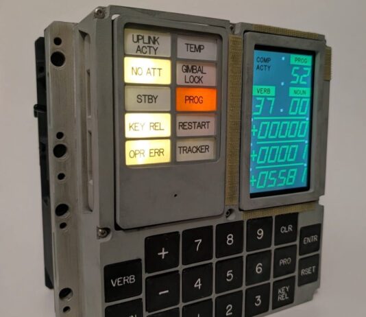 The finished build, with 3D-printed housing and a modern display behind the original panel layout. (Image: Michael Newton)