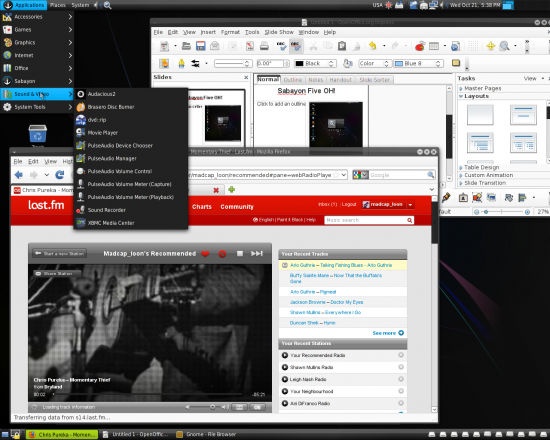 Figure 6: Enjoying last.fm in Firefox; F-Spot photo manager in the background